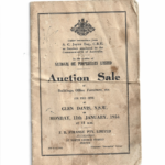 A screenshot of the front cover of National Oil Pty Ltd, auction sale book. It is brown cover with a single black line border. It is headed up with Federal Government coat of arms. Following this are the words under instructions of A. C. Joyce Esq. C.B.E. As receiver appointed by the Commonwealth of Australia. In the matter of National Oil Pty Ltd. Auction sale of Buildings Office Furniture etc. on the site of Glen Davis N.S.W. on Monday the 11th January, 1954 at 11a.m. F. R. Strange Pty Ltd, Auctioneers, 57 North George Street, Sydney. B.W. 6129 – 6902 Telegrams: Strangelim Sydney
