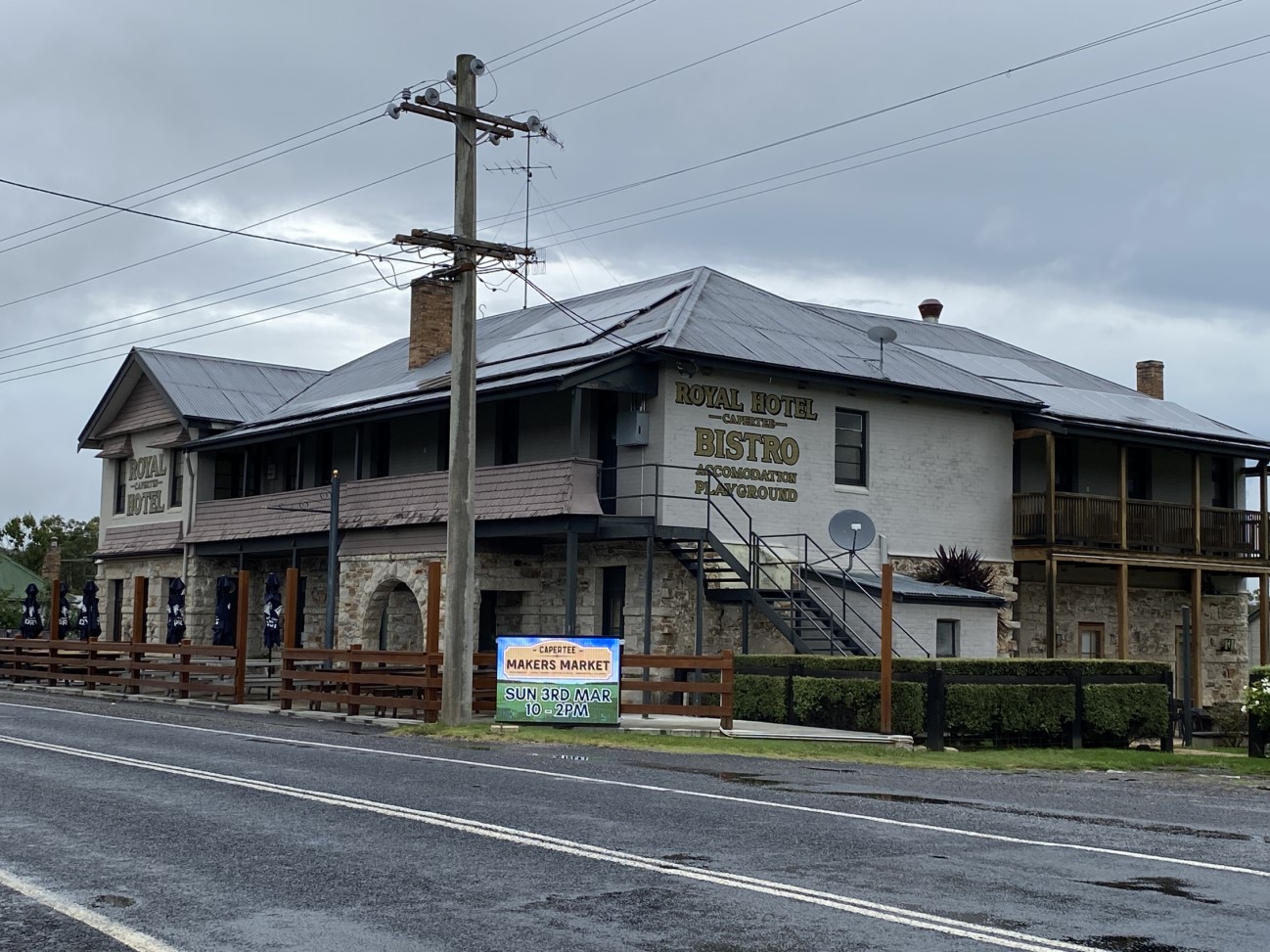 The Historical Capertee Royal Hotel building at Capertee the gateway to the Capertee Valley. With an Electronic sign advertising Capertee Makers Market.