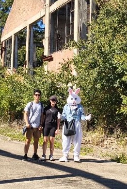 Glen Davis Tour participants 20250420 power house and retort in background.
