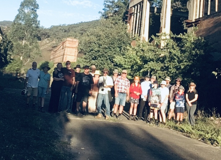 Glen Davis Tour participants 20250419 power house and retort in background.